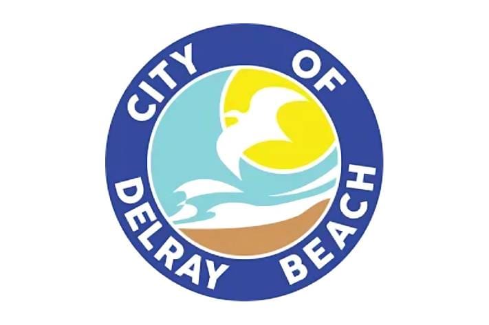 A blue circle with the city of delray beach written on it.